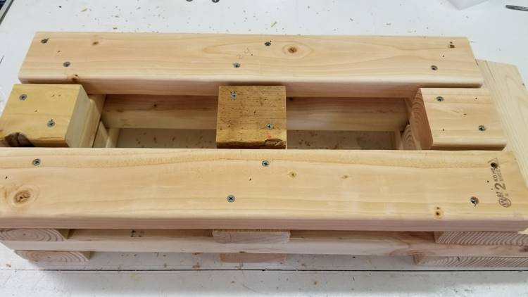 A wooden box

Description generated with high confidence