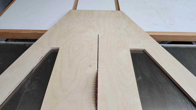 A wooden coffin with cut out holes

Description automatically generated with medium confidence